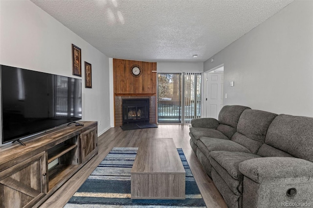 living room featuring hardwood / wood-style floors and a textured ceiling