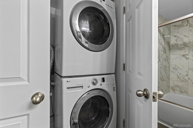 clothes washing area with stacked washer / drying machine