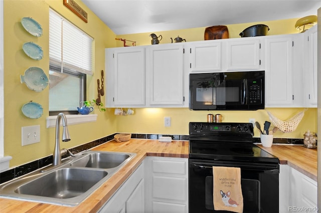 kitchen with black appliances, white cabinets, sink, and wooden counters