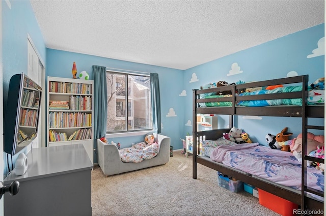 carpeted bedroom featuring a textured ceiling