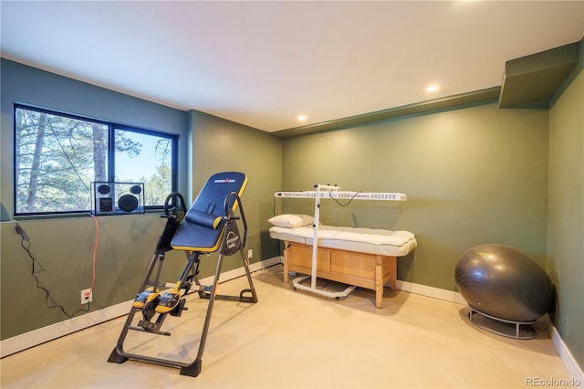 exercise room featuring recessed lighting and baseboards