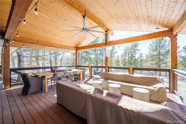 deck featuring ceiling fan and an outdoor living space