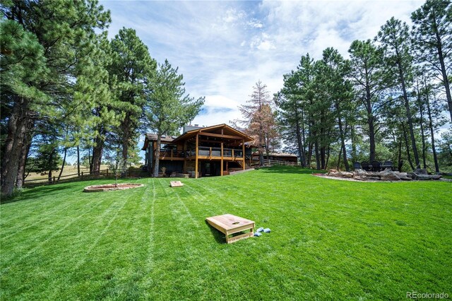 view of yard with a wooden deck