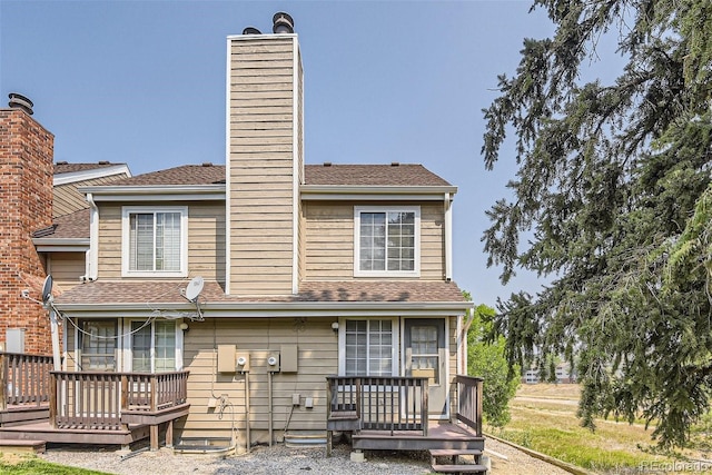 back of house featuring a deck