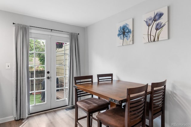 9632 W Chatfield Ave Unit C, Littleton, CO 80128 - dining area with french doors and wood finished floors
