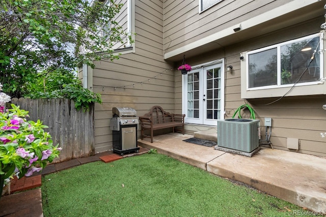 9632 W Chatfield Ave Unit C, Littleton, CO 80128 - view of yard with french doors, central air condition unit, and a patio area
