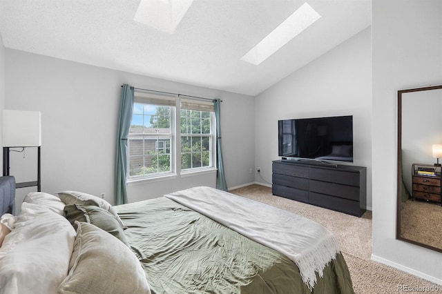 9632 W Chatfield Ave Unit C, Littleton, CO 80128 - bedroom with a skylight, carpet floors, lofted ceiling, and baseboards
