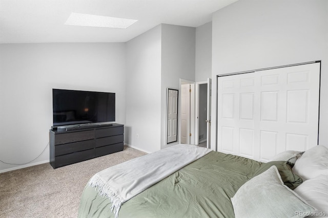9632 W Chatfield Ave Unit C, Littleton, CO 80128 - bedroom with a skylight, carpet floors, baseboards, and a closet