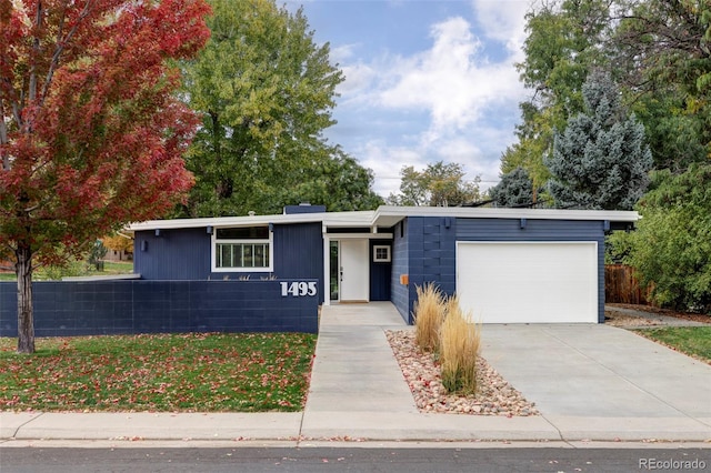 single story home featuring a garage