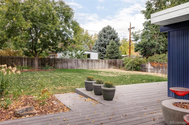 wooden deck with a lawn