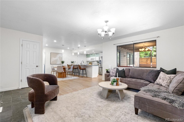 9587 W 89th Cir, Broomfield, CO 80021 - living area featuring a chandelier and recessed lighting