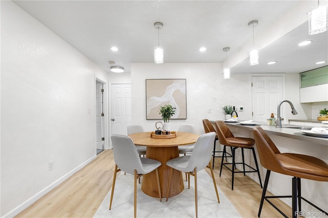 9587 W 89th Cir, Broomfield, CO 80021 - dining space with light wood-style floors and recessed lighting