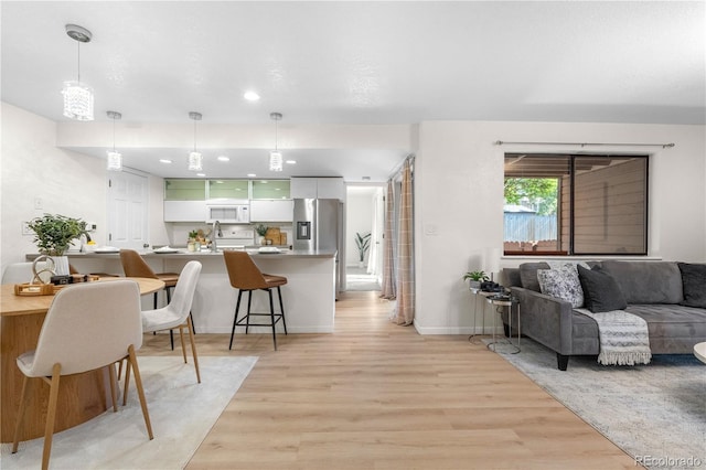 9587 W 89th Cir, Broomfield, CO 80021 - living area with light wood-type flooring and recessed lighting