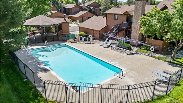 9587 W 89th Cir, Broomfield, CO 80021 - community pool featuring a patio, a gazebo, and a residential view