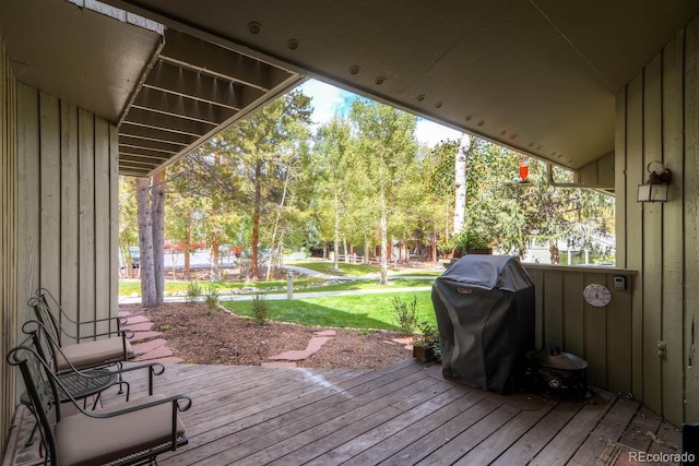 1937 Soda Ridge Rd Unit 1132, Dillon, CO 80435 - wooden deck featuring a grill, a yard, and view of wooded area