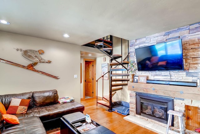 1937 Soda Ridge Rd Unit 1132, Dillon, CO 80435 - living room with stairs, wood finished floors, recessed lighting, and a stone fireplace