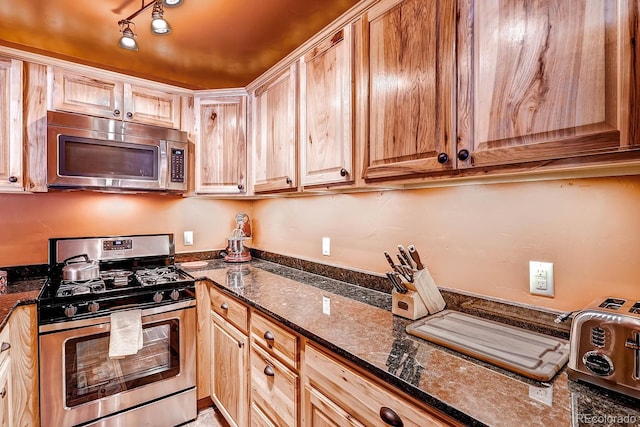 1937 Soda Ridge Rd Unit 1132, Dillon, CO 80435 - kitchen featuring stainless steel appliances and dark stone countertops