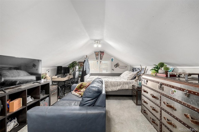 bedroom featuring lofted ceiling and light colored carpet