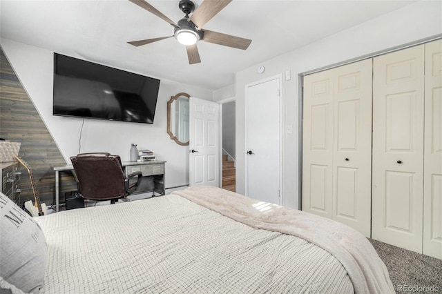 bedroom with carpet, ceiling fan, and a closet