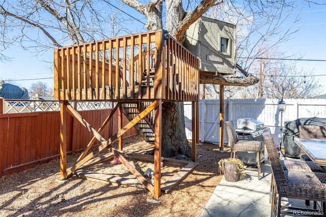 view of play area with a fenced backyard