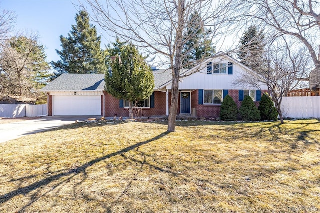 view of front of house featuring a garage, fence, and brick siding