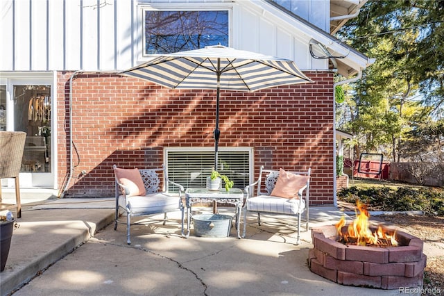 view of patio featuring a fire pit