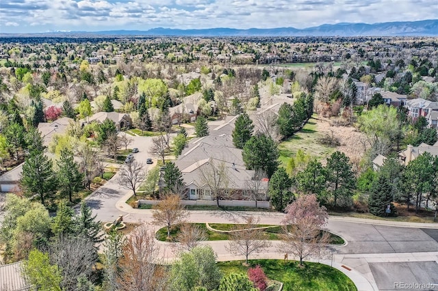 aerial view of residential area featuring a mountain backdrop