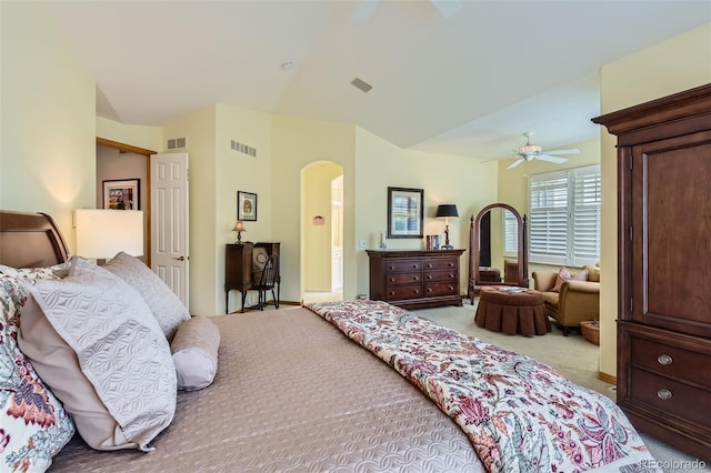bedroom with carpet flooring, arched walkways, ceiling fan, and baseboards