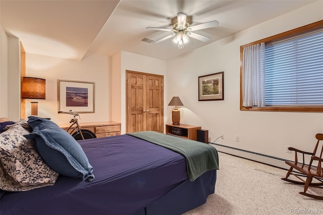 bedroom with carpet floors, a ceiling fan, and a baseboard radiator