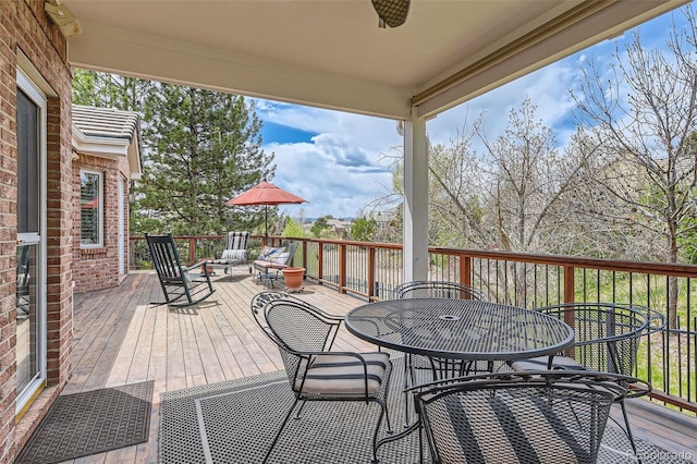 wooden deck with outdoor dining area