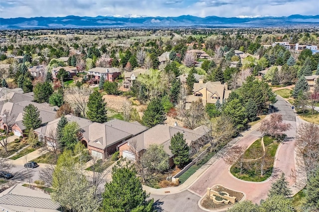 aerial view of residential area featuring a mountainous background