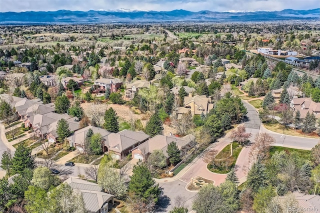 aerial view of residential area with mountains