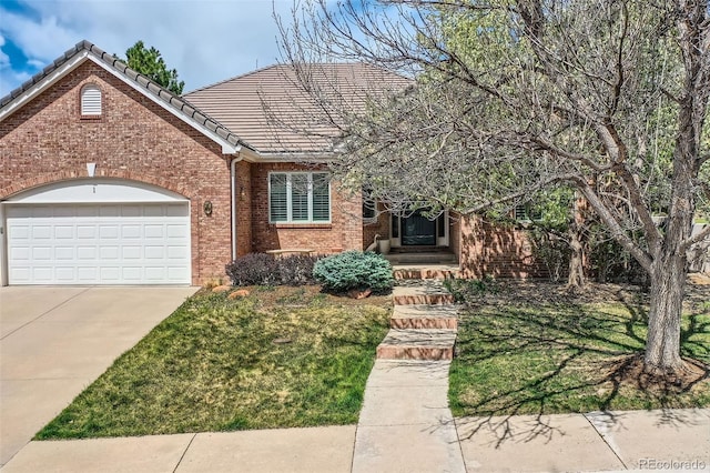 view of front of property featuring concrete driveway, an attached garage, brick siding, and a tile roof
