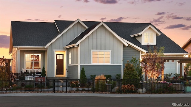 332 Agoseris Way, Castle Rock, CO 80104 - view of front facade with a fenced front yard and board and batten siding