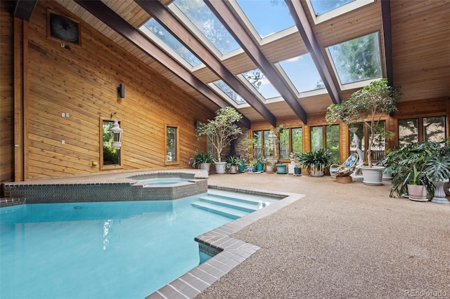 7351 Poppy Way, Arvada, CO 80007 - view of swimming pool featuring a skylight and a pool with connected hot tub