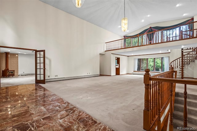 7351 Poppy Way, Arvada, CO 80007 - living room with high vaulted ceiling, a baseboard heating unit, carpet, recessed lighting, and stairway
