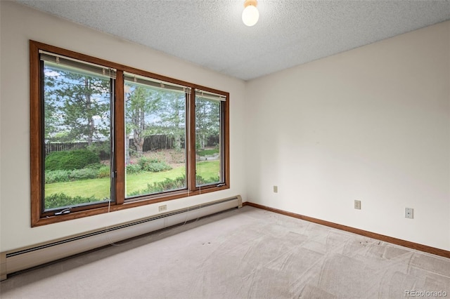 7351 Poppy Way, Arvada, CO 80007 - unfurnished room with baseboard heating, a textured ceiling, and light colored carpet