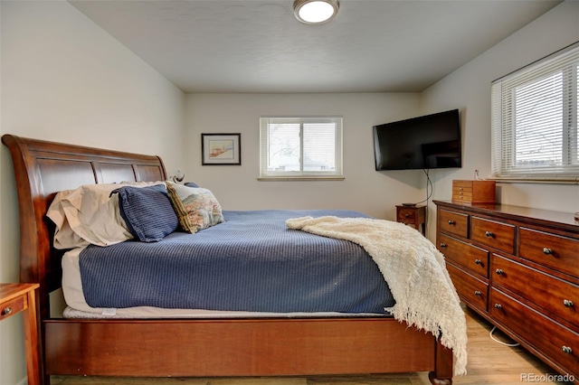 bedroom with wood finished floors