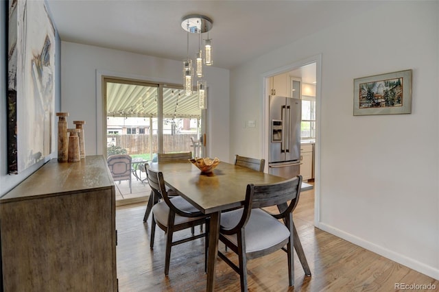 6020 Quail St, Arvada, CO 80004 - dining space featuring wood finished floors and baseboards