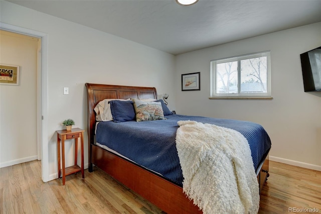 6020 Quail St, Arvada, CO 80004 - bedroom with wood finished floors and baseboards