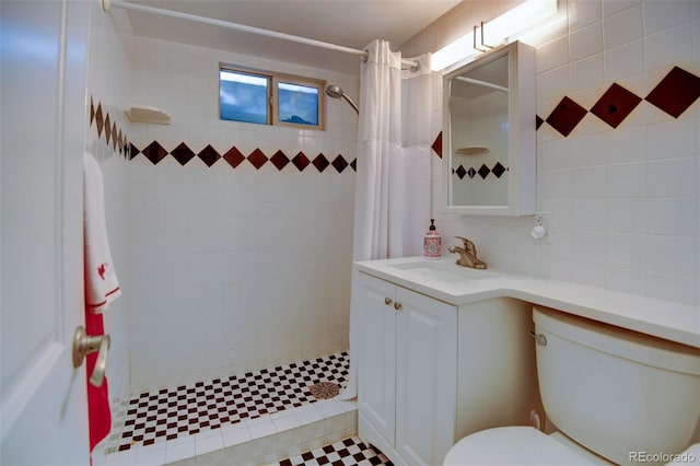 6020 Quail St, Arvada, CO 80004 - bathroom featuring vanity and a tile shower