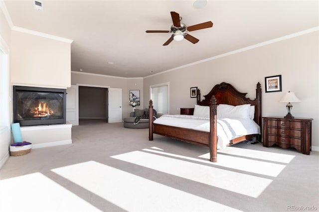 bedroom with light carpet, crown molding, and ceiling fan