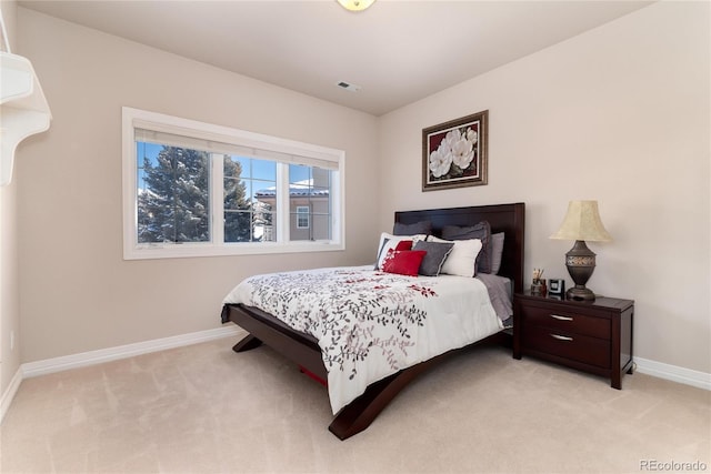 bedroom with light carpet