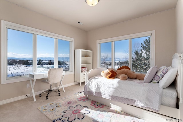 carpeted bedroom featuring a mountain view