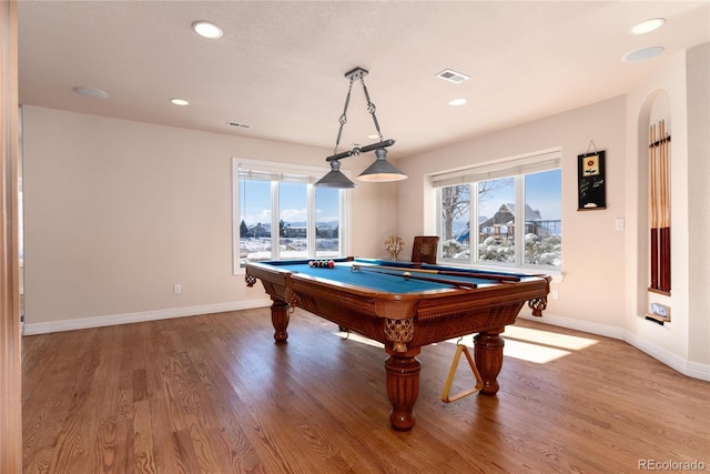 rec room with hardwood / wood-style floors, billiards, and a healthy amount of sunlight