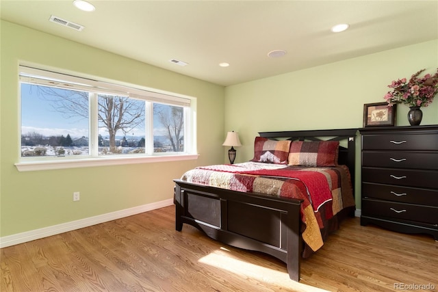 bedroom with light hardwood / wood-style flooring