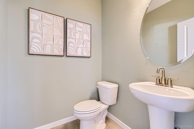 bathroom featuring sink and toilet