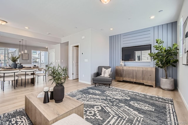 living room with light hardwood / wood-style flooring