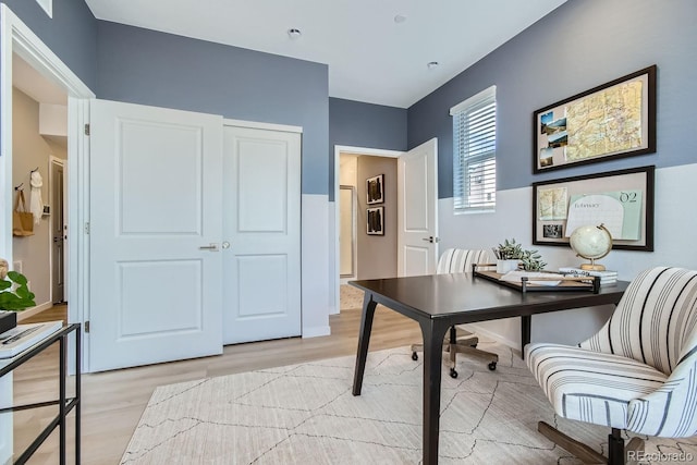 office with light hardwood / wood-style flooring