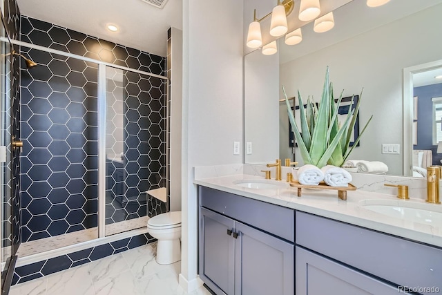 bathroom with toilet, an enclosed shower, and vanity